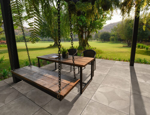 Wooden,Chair,With,Table,And,Green,Flora,On,Patio