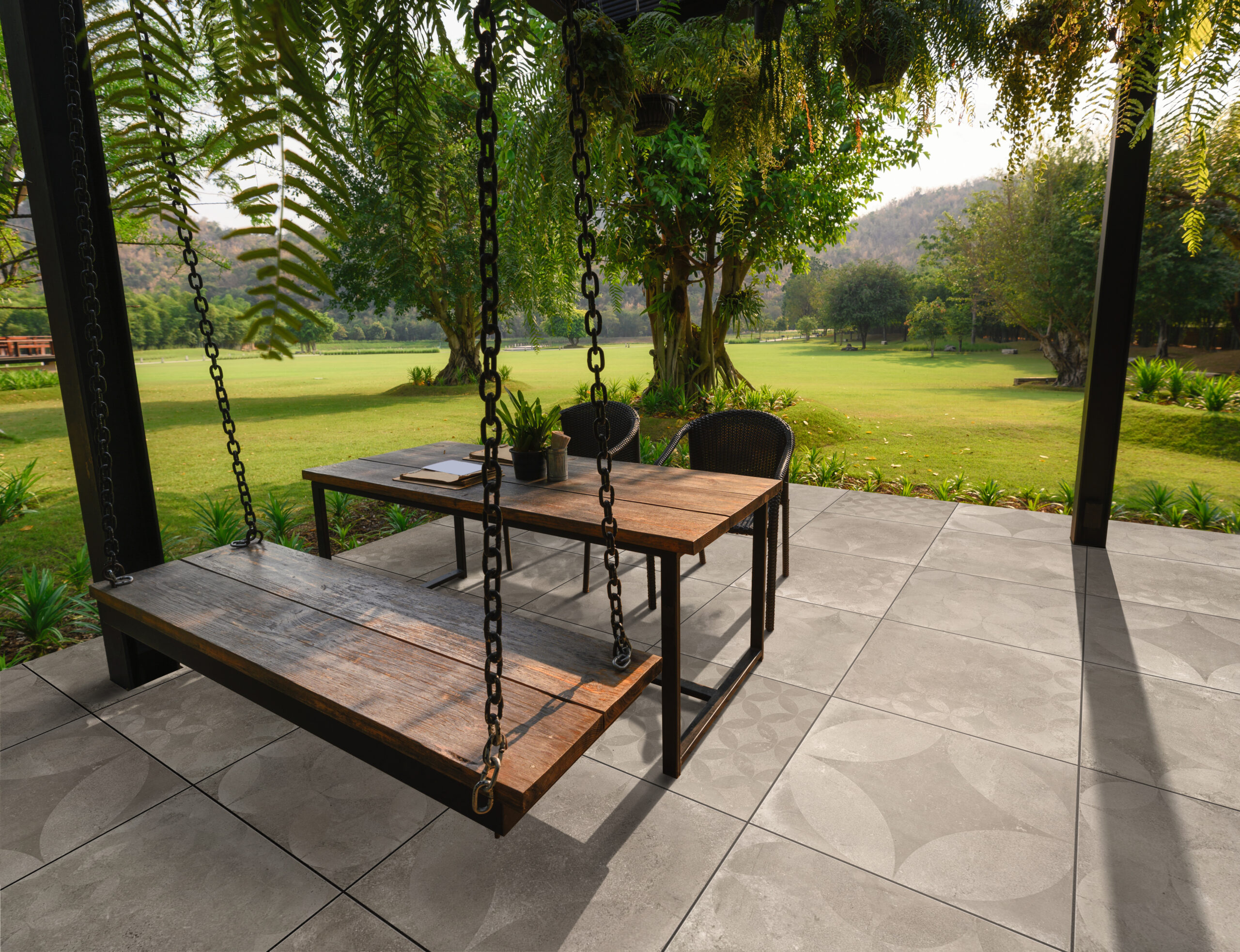 Wooden,Chair,With,Table,And,Green,Flora,On,Patio
